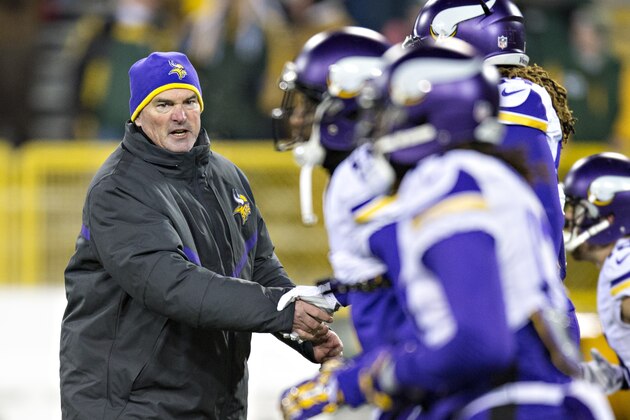 GREEN BAY, WI - JANUARY 3:  Head Coach Mike Zimmer of the Minnesota Vikings greets players on the field as the warm up before a game against the Green Bay Packers at Lambeau Field on January 3, 2016 in Green Bay, Wisconsin.  The Vikings defeated the Packers 20-13.  (Photo by Wesley Hitt/Getty Images)