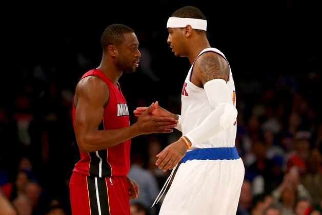 NEW YORK, NY - NOVEMBER 27:  Dwyane Wade #3 of the Miami Heat and Carmelo Anthony #7 of the New York Knicks greet each other before the opening tipoff at Madison Square Garden on November 27, 2015 in New York City.NOTE TO USER: User expressly acknowledges and agrees that, by downloading and/or using this Photograph, user is consenting to the terms and conditions of the Getty Images License Agreement.  (Photo by Elsa/Getty Images)