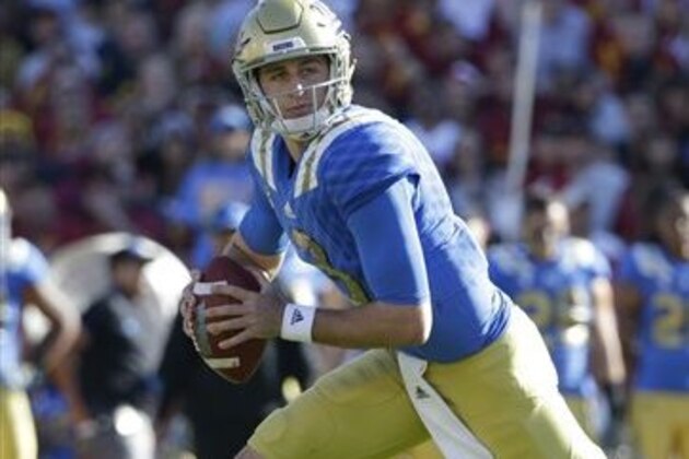FILE - In this Nov. 28, 2015, file photo, UCLA quarterback Josh Rosen breaks away from a Southern California defender during the first half of an NCAA college football game, in Los Angeles. Rosen was named to the Pac-12 All-Conference team Thursday, Dec. 17, 2015. (AP Photo/Jae C. Hong, File)