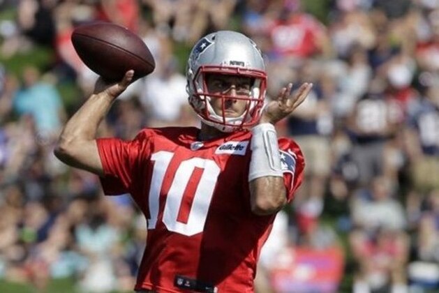 New England Patriots quarterback Jimmy Garoppolo (10) winds up for a pass during an NFL football training camp practice Thursday, July 28, 2016, in Foxborough, Mass. (AP Photo/Steven Senne)