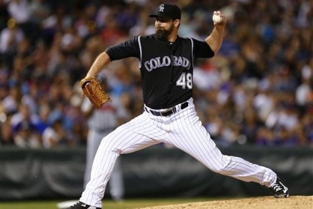 Colorado Rockies relief pitcher Boone Logan throws against the Atlanta Braves during the eighth inning of a baseball game, Thursday, July 21, 2016, in Denver. (AP Photo/Jack Dempsey)