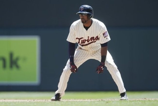 Minnesota Twins’ Eduardo Nunez takes a lead at first base in a baseball game against the Oakland Athletics Wednesday, July 6, 2016, in Minneapolis. (AP Photo/Jim Mone)