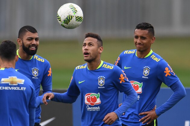 Brazilian Olympic football team players Neymar (C), Marquinhos (R) and Gabriel take part in a training session ahead of the Rio 2016 Olympic Games at the Granja Comary sport complex  in Teresopolis, about 90 km from Rio de Janeiro, Brazil, on July 22, 2016 . / AFP / VANDERLEI ALMEIDA        (Photo credit should read VANDERLEI ALMEIDA/AFP/Getty Images)