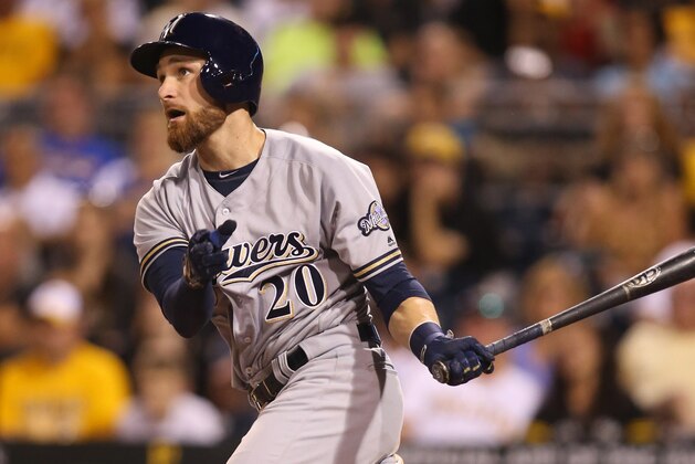 Jul 20, 2016; Pittsburgh, PA, USA; Milwaukee Brewers catcher Jonathan Lucroy (20) drives in a run against the Pittsburgh Pirates during the eighth inning at PNC Park. Milwaukee won 9-5. Mandatory Credit: Charles LeClaire-USA TODAY Sports
