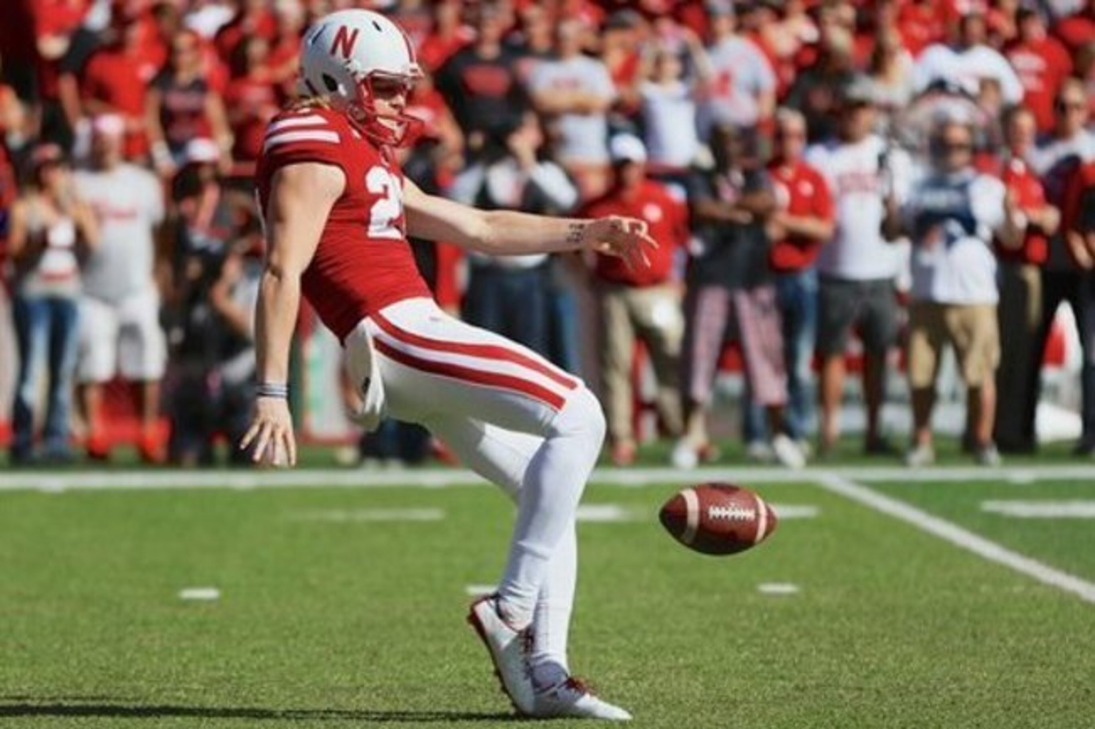 Nebraska punter Sam Foltz (27) punts during the first half of an NCAA college football game against Wisconsin in Lincoln, Neb., Saturday, Oct. 10, 2015. (AP Photo/Nati Harnik)