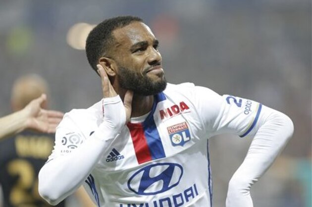 Lyon's Alexandre Lacazette celebrates after he scored a goal against Monaco during their French League One soccer match in Decines, near Lyon, central France, Saturday, May 7, 2016. (AP Photo/Laurent Cipriani)