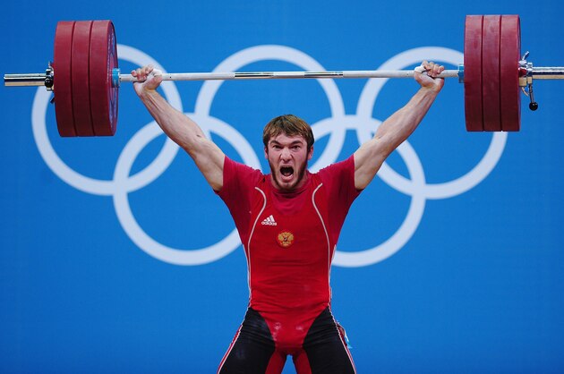 LONDON, ENGLAND - AUGUST 03:  Apti Aukhadov of Russia competes during the Men's 85kg Weightlifting Final on Day 7 of the London 2012 Olympic Games at ExCeL on August 3, 2012 in London, England.  (Photo by Laurence Griffiths/Getty Images)