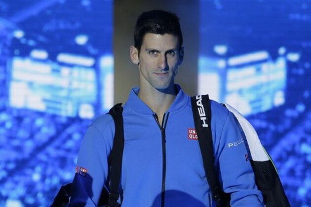 Novak Djokovic of Serbia arrives for his ATP World Tour Finals final tennis match against Roger Federer of Switzerland at the O2 Arena in London, Sunday Nov. 22, 2015. (AP Photo/Tim Ireland)