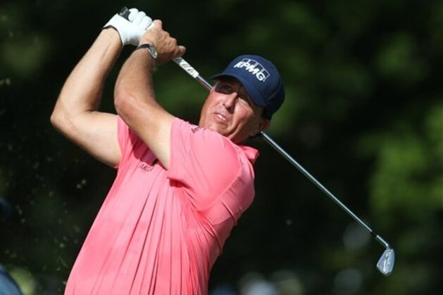 Phil Mickelson watches his tee shot on the 12th hole during the first round of the PGA Championship golf tournament at Baltusrol Golf Club in Springfield, N.J., Thursday, July 28, 2016. (AP Photo/Seth Wenig)