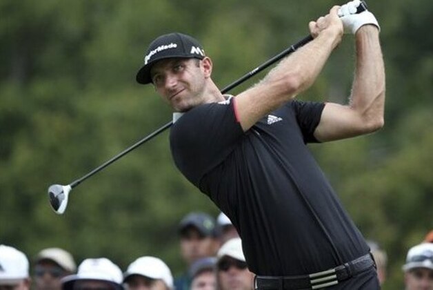 Dustin Johnson watches his tee shot on the 11th hole during the first round of the PGA Championship golf tournament at Baltusrol Golf Club in Springfield, N.J., Thursday, July 28, 2016. (AP Photo/Seth Wenig)