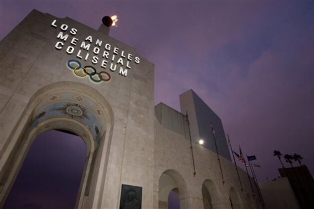 FILE - This Feb. 13, 2008, file photo shows the Los Angeles Memorial Coliseum in Los Angeles. The aging Los Angeles Memorial Coliseum is slated for a major overhaul, but it’s not known how much work will be needed to harden the structure against earthquakes in time to make a credible bid for the 2024 Olympics. The 1994 Northridge earthquake heavily damaged the stadium, even though it was 20 miles from the epicenter and the strongest shaking traveled away from the Coliseum (AP Photo/Damian Dovarganes, File)