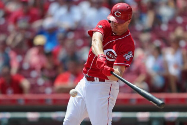 Cincinnati Reds' Jay Bruce hits an RBI-single off of Arizona Diamondbacks starting pitcher Zack Godley in the third inning of a baseball game, Sunday, July 24, 2016, in Cincinnati. (AP Photo/Aaron Doster)