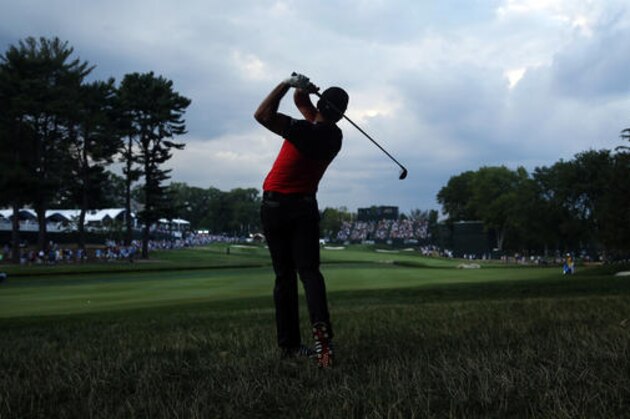 Jason Day hits his approach shot to the 18th hole during the second round of the PGA Championship golf tournament at Baltusrol Golf Club in Springfield, N.J., Friday, July 29, 2016. (AP Photo/Mike Groll)