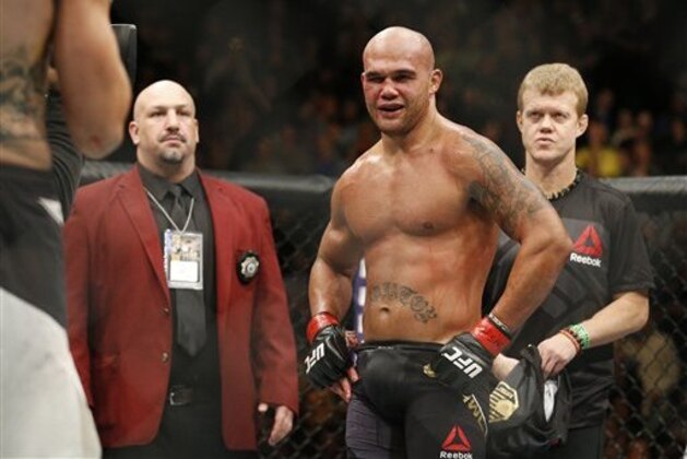 Robbie Lawler, right, after defeating Carlos Condit during a welterweight championship mixed martial arts bout at UFC 195, Saturday, Jan. 2, 2016, in Las Vegas. (AP Photo/John Locher)
