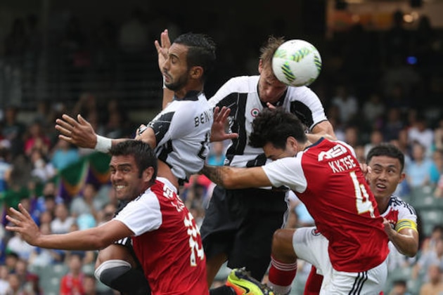 Deniele Rugani, top right, and Medhi Benatia, top left, of Juventus FC, head on the ball as they blocked by Sean Tse, right and Vieira Junior Luiz Carlos, left, of South China FC, during the International Challenge Cup, a friendly football match in Hong Kong, Saturday, July 30, 2016. (AP Photo/Kin Cheung)