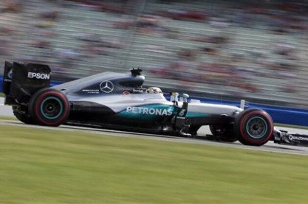 In this photo taken with slow shutter speed Mercedes driver Lewis Hamilton of Britain steers his car during a Formula One training session in Hockenheim, Germany, Saturday, July 30, 2016. The German Formula One Grand Prix takes place in Hockenheim on Sunday, July 31, 2016. (AP Photo/Michael Probst)