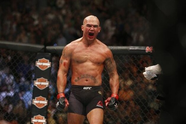 Robbie Lawler celebrates after defeating Rory MacDonald during their welterweight title fight mixed martial arts bout at UFC 189 Saturday, July 11, 2015, in Las Vegas. (AP Photo/John Locher)