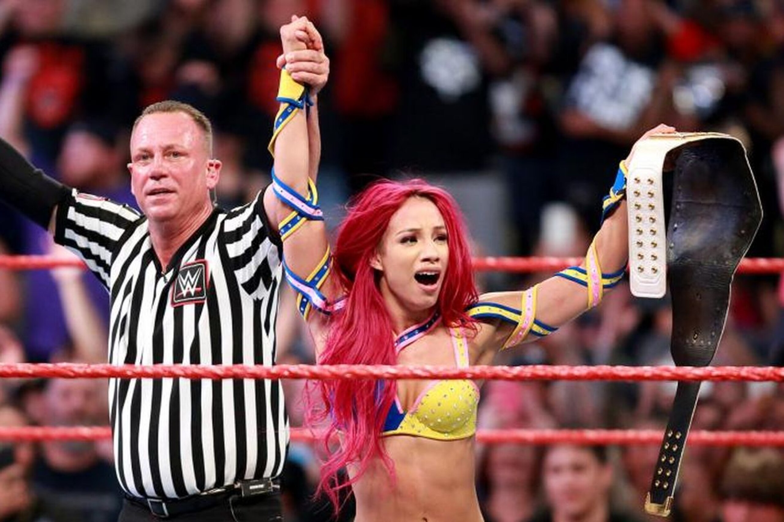 Sasha Banks celebrating her Women's Championship win. Sasha Banks celebrating her Women's Championship win.