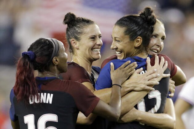 United States forward Christen Press, second from right, is congratulated by Crystal Dunn (16) Kelley O'Hara, second from left, and Allie Long, right, after scoring against Costa Rica in the second half of women's international friendly soccer match, Friday, July. 22, 2016, in Kansas City, Kan. (AP Photo/Colin E. Braley)