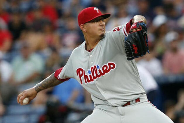 Philadelphia Phillies starting pitcher Vince Velasquez works against Atlanta Braves during the first inning of a baseball game Friday, July 29, 2016, in Atlanta. (AP Photo/John Bazemore)