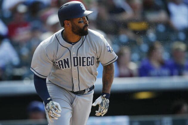San Diego Padres' Matt Kemp runs up the first base line after hitting a double off Colorado Rockies relief pitcher Jason Motte to lead off the top of the ninth inning of a baseball game Saturday, June 11, 2016, in Denver. The Rockies won 5-3. (AP Photo/David Zalubowski)