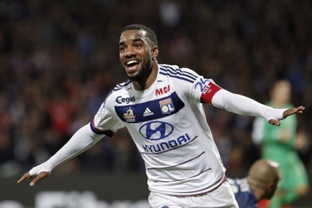 Lyon's Alexandre Lacazette celebrates after he scored his third goal against Saint-Etienne during their French League One soccer match at Gerland stadium, in Lyon, central France, Sunday, Nov. 8, 2015. (AP Photo/Laurent Cipriani)