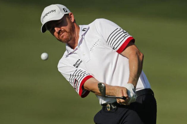 Jimmy Walker chips to the 15th green during the second round of the PGA Championship golf tournament at Baltusrol Golf Club in Springfield, N.J., Friday, July 29, 2016. (AP Photo/Mike Groll)