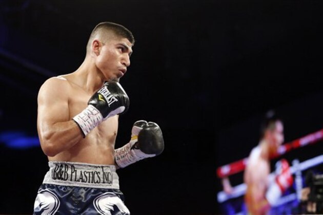 Mikey Garcia in action against Juan Carlos Burgos during their WBO Super Featherweight title fight on Saturday, January 25, 2014 in New York City. Garcia won via unanimous decision. (AP Photo/Gregory Payan)