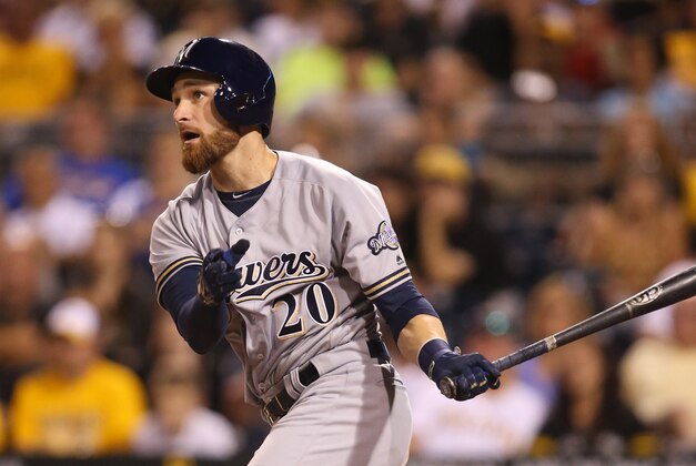Jul 20, 2016; Pittsburgh, PA, USA; Milwaukee Brewers catcher Jonathan Lucroy (20) drives in a run against the Pittsburgh Pirates during the eighth inning at PNC Park. Milwaukee won 9-5. Mandatory Credit: Charles LeClaire-USA TODAY Sports