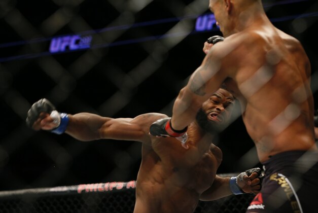 Jul 30, 2016; Atlanta, GA, USA; Robbie Lawler (red gloves) competes against Tyron Woodley (blue gloves) for the world welterweight championship during UFC 201 at Phillips Arena. Mandatory Credit: Butch Dill-USA TODAY Sports