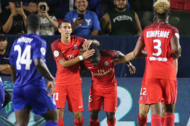 Paris Saint-Germain 's Jonathan Ikone, center, is congratulated by teammate Angel Di Maria, left, after scoring a goal against Leicester City in the first half of International Champions Cup soccer match in Carson, Calif., Saturday, Sept. 30, 2016. (AP Photo/Reed Saxon)