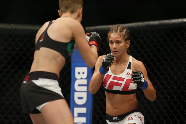 Jul 30, 2016; Atlanta, GA, USA; Rose Namajunas (red gloves) competes against Karolina Kowaliewicz (blue gloves) during UFC 201 at Phillips Arena. Mandatory Credit: Butch Dill-USA TODAY Sports