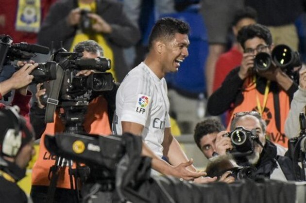 Real Madrid's Carlos Henrique Casemiro celebrates after scoring the winning goal during a Spanish La Liga soccer match at the Gran Canaria stadium in Las Palmas, Spain, Sunday March 13, 2016. Real Madrid won the match 2-1. (AP Photo/Gerado Ojeda)