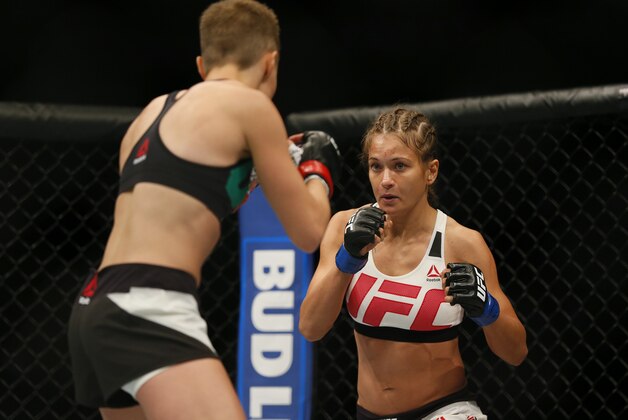 Jul 30, 2016; Atlanta, GA, USA; Rose Namajunas (red gloves) competes against Karolina Kowaliewicz (blue gloves) during UFC 201 at Phillips Arena. Mandatory Credit: Butch Dill-USA TODAY Sports
