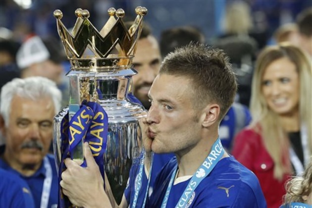 Leicester’s Jamie Vardy kisses the trophy as Leicester City celebrate becoming the English Premier League soccer champions at King Power stadium in Leicester, England, Saturday, May 7, 2016.(AP Photo/Matt Dunham)