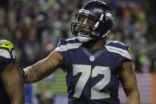 Seattle Seahawks defensive end Michael Bennett on the field during an NFL football game against the Arizona Cardinals, Sunday, Nov. 15, 2015, in Seattle. (AP Photo/Elaine Thompson)