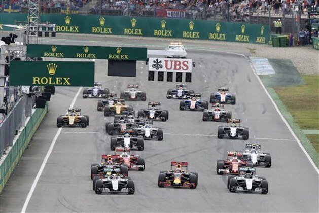 Britain's Lewis Hamilton, left, leads the field right after the start of the German Formula One Grand Prix in Hockenheim, Germany, Sunday, July 31, 2016. (AP Photo/Michael Probst)