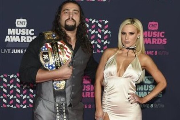 Professional wrestler Alexander Rusev, left, and Lana arrive at the CMT Music Awards at the Bridgestone Arena on Wednesday, June 8, 2016, in Nashville, Tenn. (Photo by Sanford Myers/Invision/AP)
