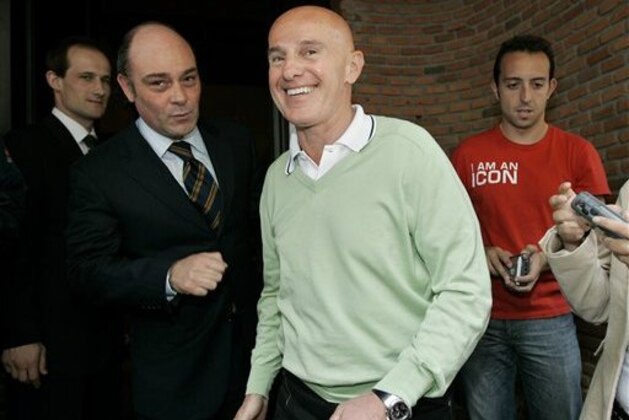 Real Madrid's soccer director Arrigo Sacchi, centre, of Italy leaves a restaurant  in Madrid, Tuesday, May 10, 2005, after having lunch with former Argentine World Cup hero Diego Armando Maradona. Maradona is in Spain to visit friends. (AP Photo/Manu Fernandez)