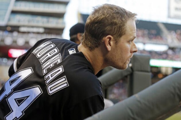 Former Minnesota Twins player Justin Morneau waits to bat in the fourth inning during his return to Target Field as a Chicago White Sox designated hitter in a baseball game against the Twins, Friday, July 29, 2016, in Minneapolis. (AP Photo/Jim Mone)