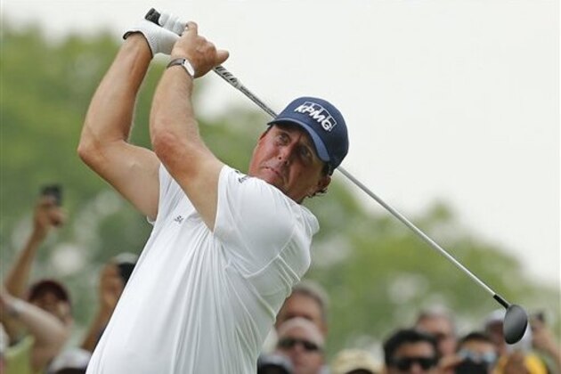 Phil Mickelson watches his tee shot on the 18th hole during the third round of the PGA Championship golf tournament at Baltusrol Golf Club in Springfield, N.J., Saturday, July 30, 2016. (AP Photo/Mike Groll)