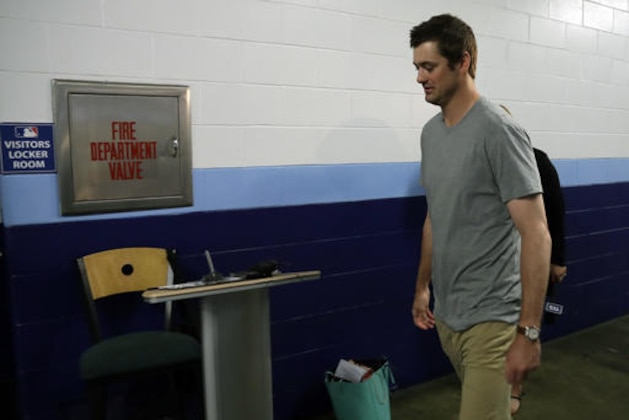 New York Yankees relief pitcher Andrew Miller walks to the clubhouse after being traded to the Cleveland Indians before a baseball game against the Tampa Bay Rays Sunday, July 31, 2016, in St. Petersburg, Fla. (AP Photo/Chris O'Meara)