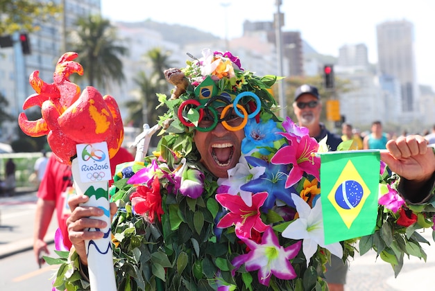 Jul 31, 2016; Rio de Janeiro, BRAZIL;  A Brazilian fan at Copacabana Beach prior to the start of the Rio 2016 Olympic Games. Mandatory Credit: Rob Schumacher-USA TODAY Sports