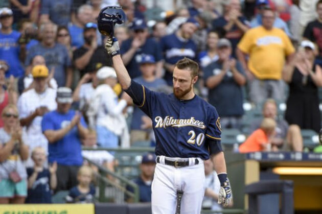 Milwaukee Brewers' Jonathan Lucroy tips his cap after getting a standing ovation from fans while pinch-hitting during the eighth inning of a baseball game against the Pittsburgh Pirates on Sunday, July 31, 2016, in Milwaukee. Lucky stopped a trade to the Cleveland Indians earlier in the day. (AP Photo/Benny Sieu)