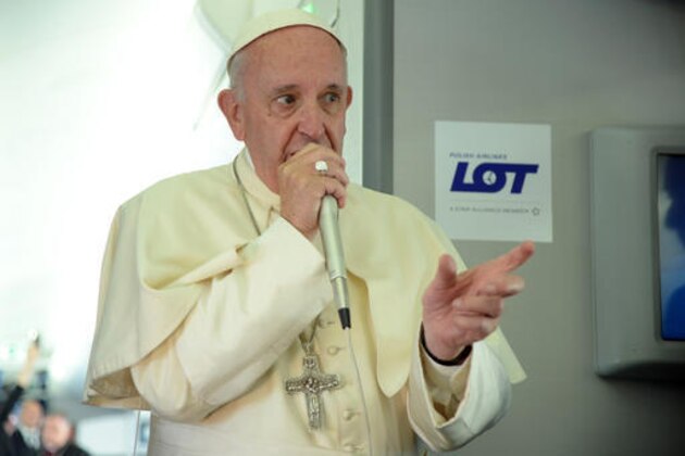 Pope Francis answers reporters questions on board the flight from Krakow, Poland, to Rome, at the end of his 5-day trip to southern Poland, Sunday, July 31, 2016. (Filippo Monteforte/Pool Photo via AP)