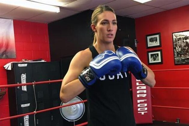 In this June 13, 2016 photo, U.S. Olympic boxer Mikaela Mayer poses at a gym in West Hills, Calif., where she is preparing for her trip to the Rio de Janeiro Olympics. (AP Photo/Greg Beachem)