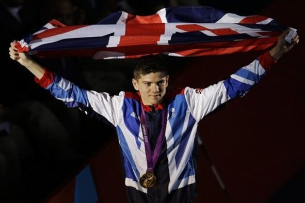 Gold medalist Luke Campbell of Great Britain, carries his country's flag after the medals ceremony for bantamweight 56-kg boxing at the 2012 Summer Olympics, Saturday, Aug. 11, 2012, in London. (AP Photo/Patrick Semansky) Gold medalist Luke Campbell of Great Britain, carries his country's flag after the medals ceremony for bantamweight 56-kg boxing at the 2012 Summer Olympics, Saturday, Aug. 11, 2012, in London. (AP Photo/Patrick Semansky)