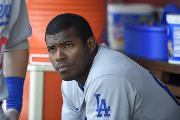 Los Angeles Dodgers' Yasiel Puig looks on from the dugout during a baseball game against the Washington Nationals, Thursday, July 21, 2016, in Washington. (AP Photo/Nick Wass)