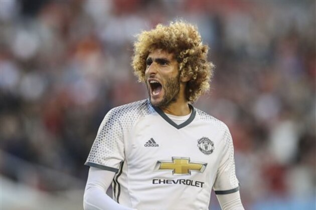 Manchester United's Marouane Fellaini celebrates after scoring their fourth goal during their pre-season friendly soccer match against Galatasaray at the Ullevi Stadium, in Gothenburg, Sweden, Sunday, July 30, 2016. (Bjorn Larsson Rosvall/TT News Agency via AP)