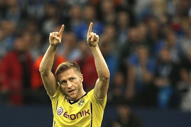 Dortmund's Jakub Blaszczykowski of Poland celebrates after scoring during the German first division Bundesliga soccer match between Schalke 04 and BvB Borussia Dortmund  in Gelsenkirchen, Germany, Saturday, Oct. 26, 2013. (AP Photo/Frank Augstein)